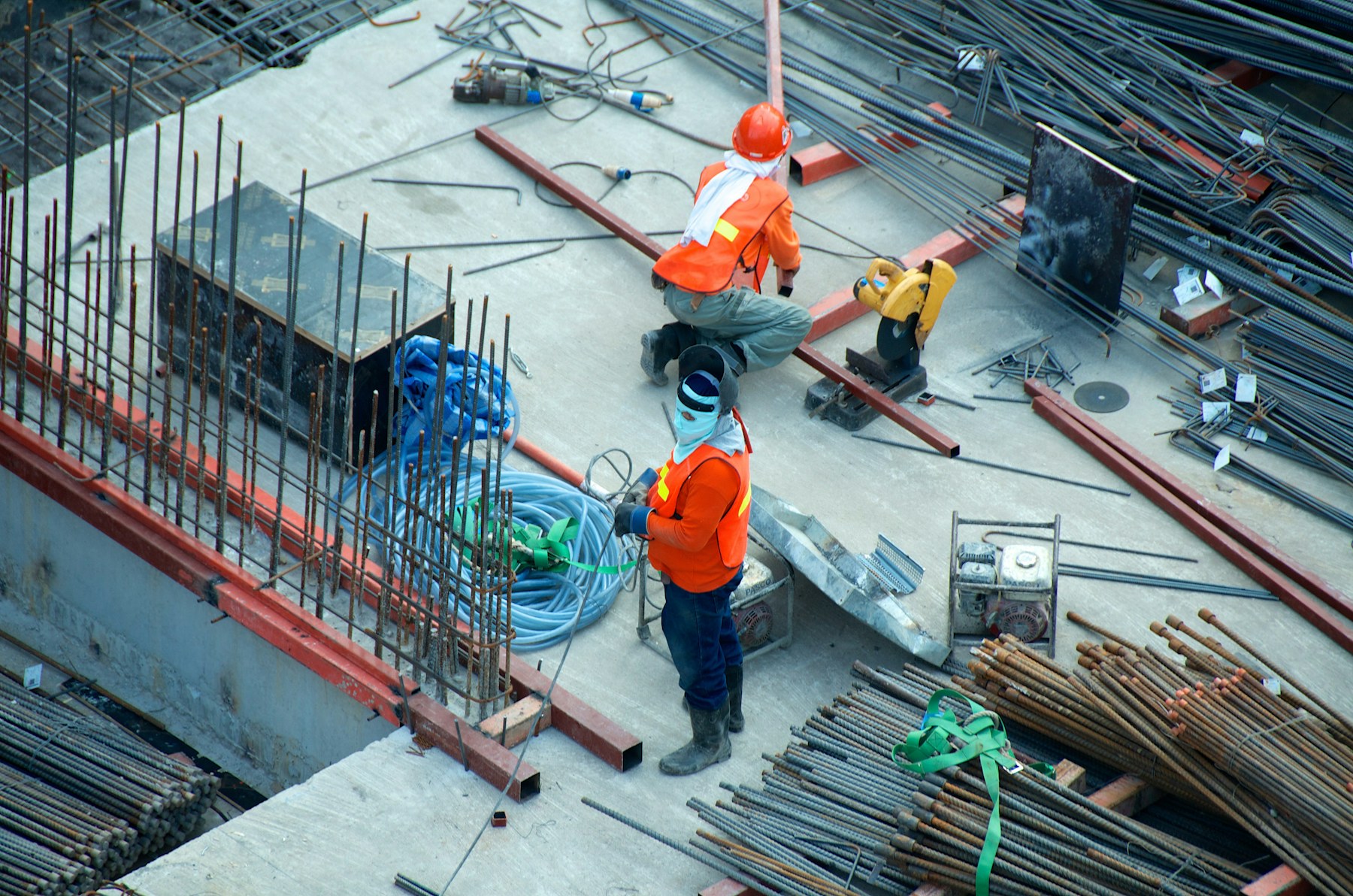 Roofing contractor inspecting roof tiles